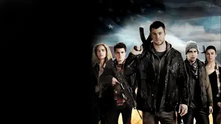 HD PC desktop wallpaper for Red Dawn (2012): a group of armed young adults in rugged jackets stand against a stormy, flag-tinted sky, a man front and center holding a rifle.