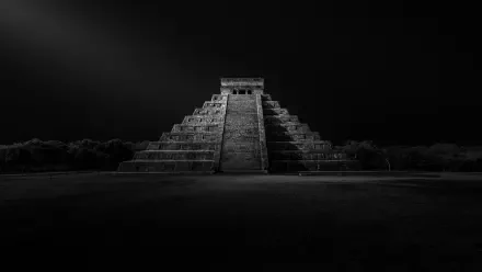 Monochrome 5K Ultra HD PC desktop wallpaper of Chichen Itza pyramid monument in Mexico, dramatic low-light composition with stark shadows.