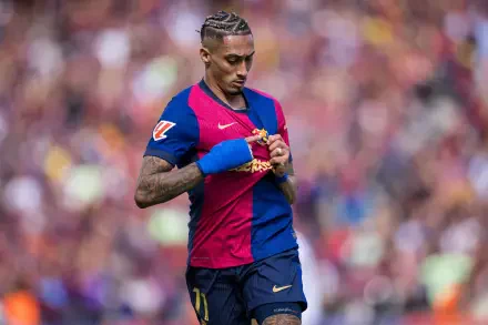 FC Barcelona soccer player adjusting his shirt on the pitch, captured in vibrant detail as a dynamic 5K Ultra HD PC desktop wallpaper background.