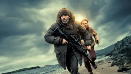 4K Ultra HD PC desktop wallpaper: two bundled figures race along a stormy shore, man with rifle leading a woman as they head toward shelter under dark, turbulent skies.