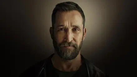 Close-up portrait of a bearded middle-aged man with short hair against a dark vignette, titled The Pitt — 4K Ultra HD PC desktop wallpaper/background.