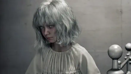 Haunted pale girl with silver hair and blank stare — Emily from Resident Evil Requiem, dim bedroom scene, 4K Ultra HD PC desktop wallpaper/background.