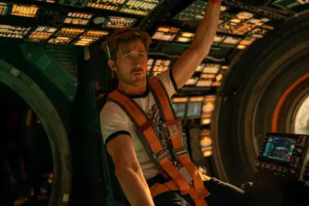 4K Ultra HD PC desktop wallpaper from the movie Project Hail Mary: astronaut in an orange harness reaches inside a glowing spacecraft cockpit.