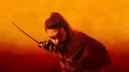 4K Ultra HD PC Desktop Wallpaper and Background — lone samurai-like warrior with topknot and drawn sword emerging from a fiery orange-red haze.