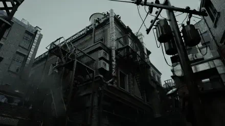 Resident Evil Requiem 2K Quad HD PC desktop wallpaper/background: moody, rain-soaked industrial building and tangled power lines under a stormy gray sky.