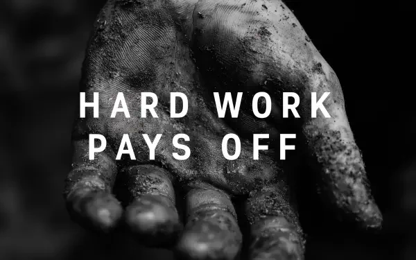 Black-and-white HD PC wallpaper: a dirt-streaked hand reaching out with bold text HARD WORK PAYS OFF as a motivational quote background.