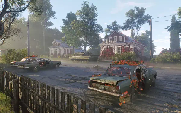 Video game Active Matter HD PC wallpaper: abandoned cars overgrown with flowers and vines on a misty suburban street, cracked pavement and wooden fences before empty, weathered houses.