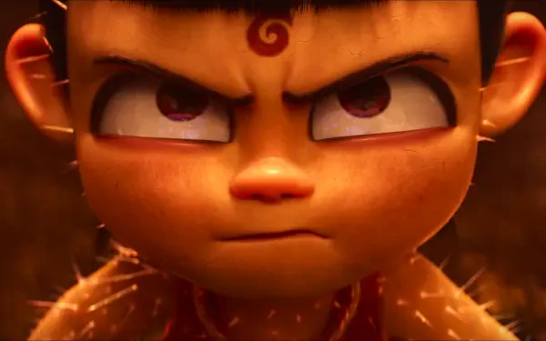 Close-up of Ne Zha from the anime movie, fierce gaze and glowing embers, rendered as a bold 2K Quad HD PC desktop wallpaper/background.