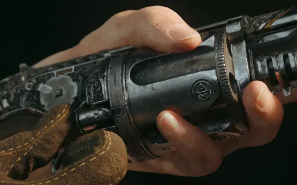 Close-up 4K Ultra HD PC desktop wallpaper/background from the video game The Forever Winter: hands gripping an ornate, frost-scored firearm with leather glove details.