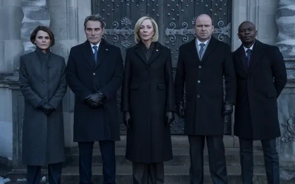 Five stern figures in dark suits and coats stand before an ornate stone doorway — promotional image from the TV show The Diplomat, 2K Quad HD PC desktop wallpaper.