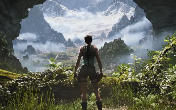 HD PC desktop wallpaper of Tomb Raider: Legacy of Atlantis — Lara Croft stands at a cave mouth overlooking misty mountains and a lush tropical valley, poised for exploration.