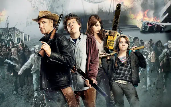Zombieland 4K Ultra HD PC desktop wallpaper: four armed survivors pose amid burning, wrecked city streets as a zombie horde advances under smoke-filled skies.