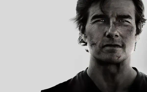 Grayscale close-up of a battle-worn male agent with cuts and a steely gaze — Mission: Impossible - The Final Reckoning 4K Ultra HD PC desktop wallpaper.