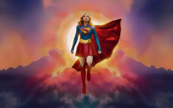 Supergirl (2026) soaring above glowing clouds at sunrise, cape billowing and emblem shining — 5K Ultra HD PC desktop wallpaper and background.