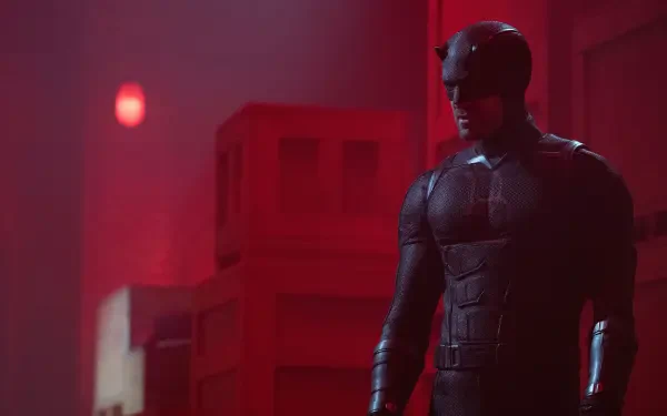 Daredevil: Born Again — armored Daredevil stands in a red-lit corridor, dramatic shadows and texture, high-detail 4K Ultra HD PC desktop wallpaper/background.