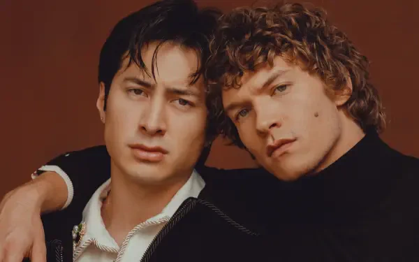 Movie 2K Quad HD PC desktop wallpaper: close-up of two young men in an intense pose, their charged expressions and closeness suggesting a heated rivalry.