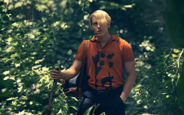 One Piece (Live Action) TV show wallpaper: Sanji in an orange shirt standing in a sunlit forest, 2K Quad HD PC desktop background.