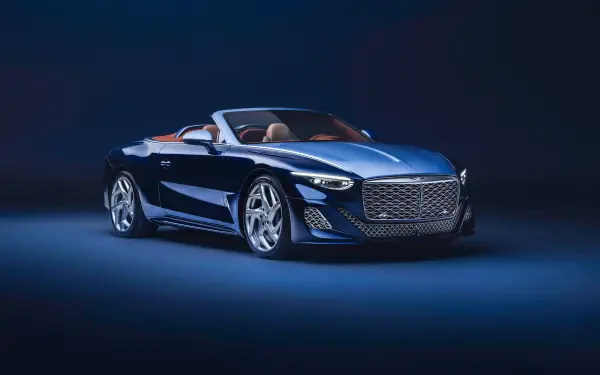 Blue Bentley Mulliner Batur convertible car in studio lighting on deep blue background — 8K Ultra HD PC desktop wallpaper.