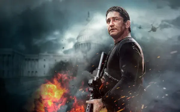 HD PC desktop wallpaper/background: Olympus Has Fallen — armed man with rifle stands before a burning Capitol building amid smoke, explosions and falling debris.