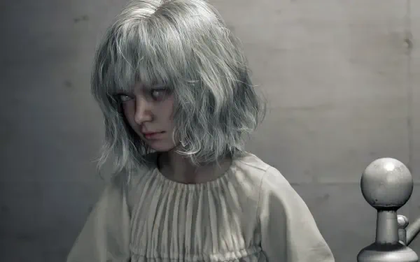 Haunted pale girl with silver hair and blank stare — Emily from Resident Evil Requiem, dim bedroom scene, 4K Ultra HD PC desktop wallpaper/background.