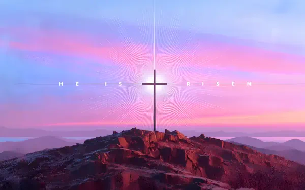 2K Quad HD PC desktop wallpaper: cross on a rocky hill at sunrise with He Is Risen text, symbolizing the empty tomb and the Christian resurrection.