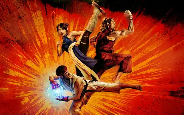 Street Fighter (2026) 2K Quad HD PC wallpaper and background: three fighters mid-air — high kick, spinning kick, energy-charged punch — over an explosive orange burst.
