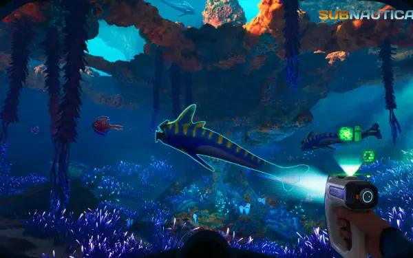 4K Ultra HD Subnautica 2 video game PC desktop wallpaper: underwater bioluminescent reef with a glowing fish and a player-held scanner illuminating the scene.