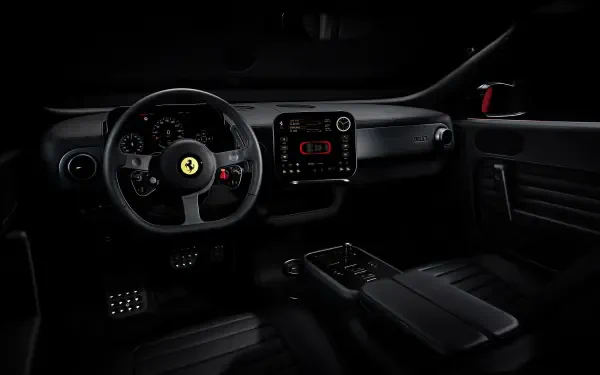 4K Ultra HD PC desktop wallpaper: dark Ferrari Luce interior—steering wheel with prancing horse emblem, dashboard, center console and pedals.