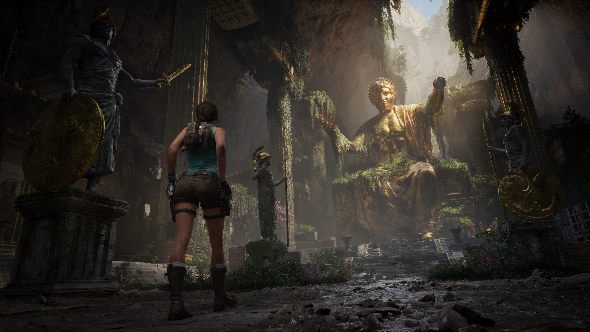 Video game hero Lara Croft from Tomb Raider: Legacy of Atlantis in a sunlit, overgrown Atlantean temple facing a colossal moss-covered statue — 4K Ultra HD PC desktop wallpaper.
