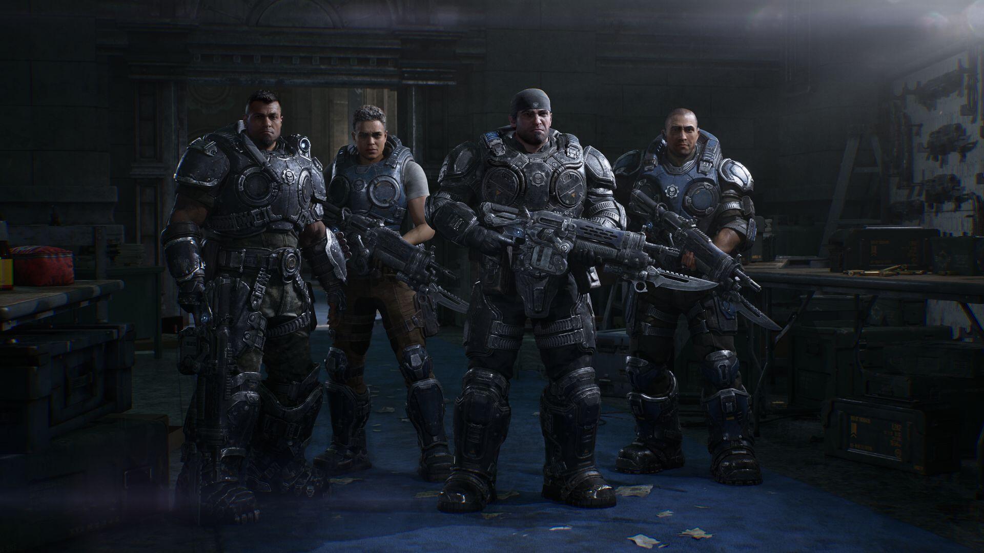 HD PC desktop wallpaper of the Gears of War video game — four heavy‑armored soldiers from Gears of War: E-Day stand armed in a dim shelter, ready for battle.