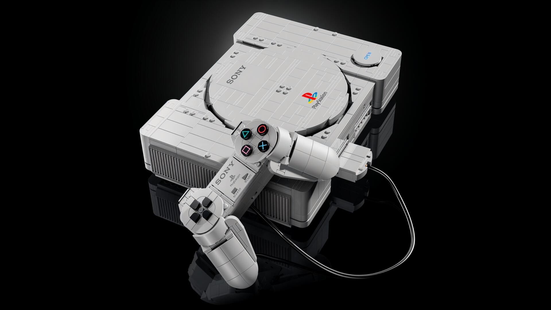 4K Ultra HD PC desktop wallpaper showing a LEGO-style PlayStation console with a wired controller on a black reflective background.