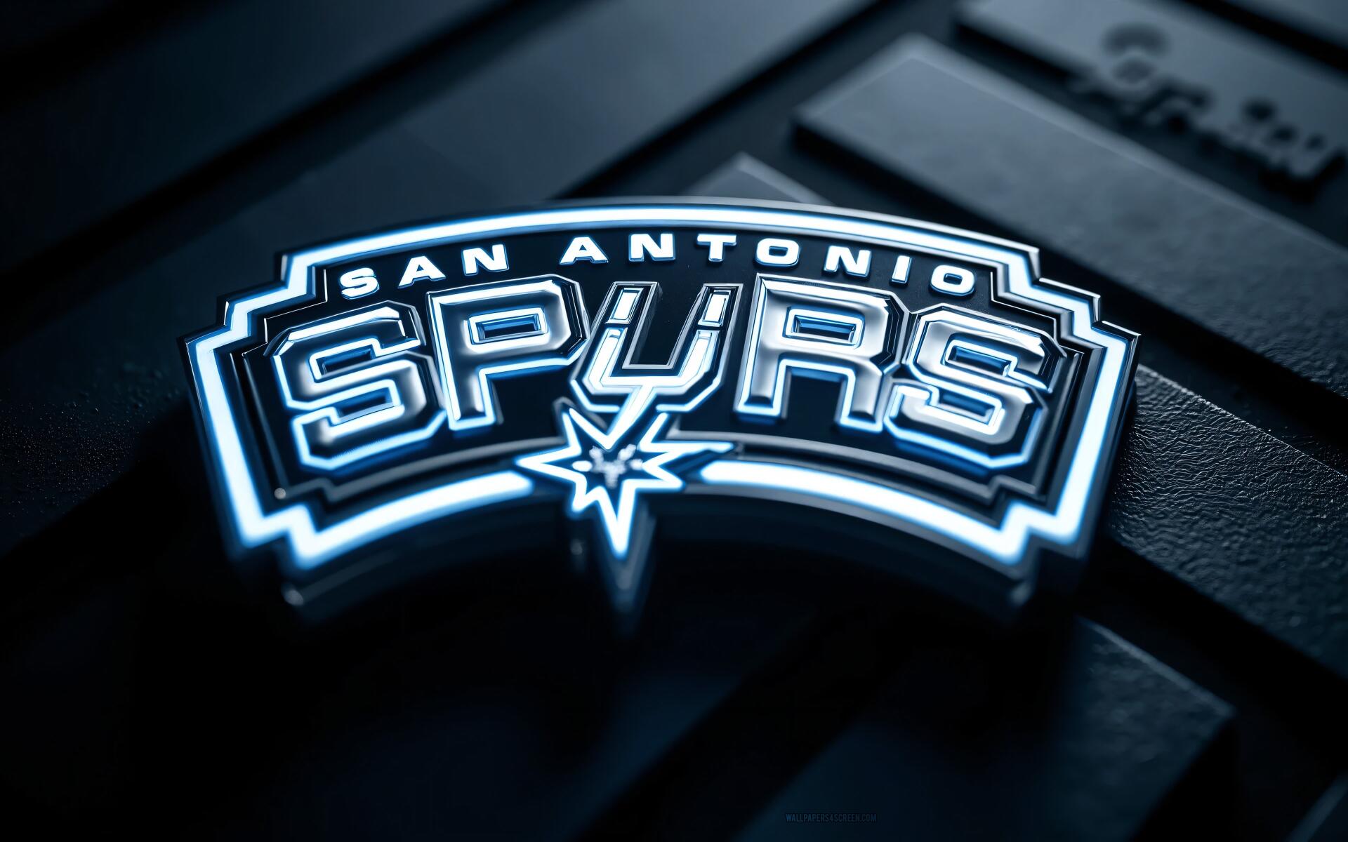 Glowing San Antonio Spurs NBA logo in neon blue on a dark textured surface — 4K Ultra HD PC desktop wallpaper.