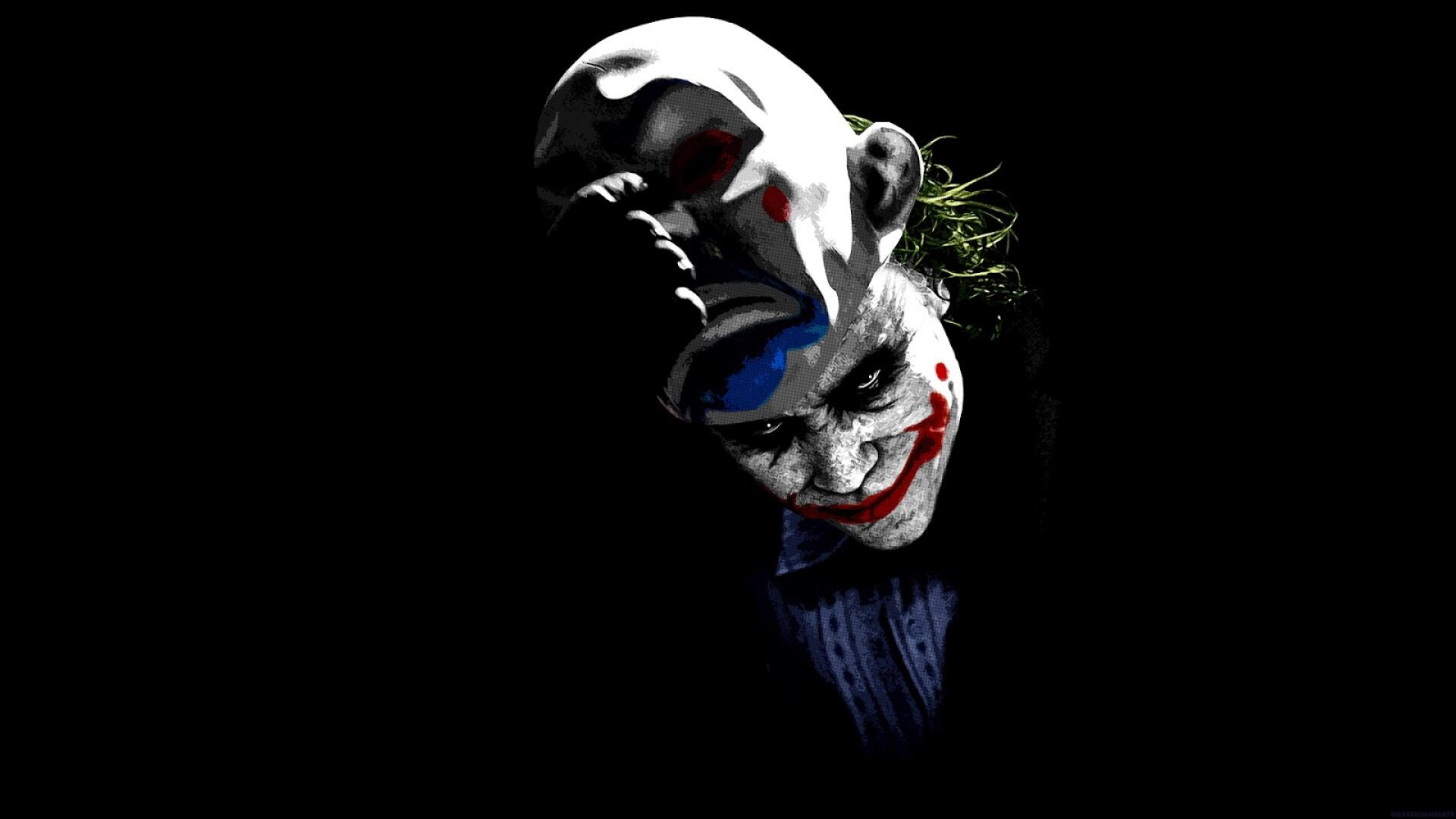 8K Ultra HD PC desktop wallpaper: Joker's painted grin and smeared red lips emerging from black, dark eyes and a faint suit in a moody, ominous composition.
