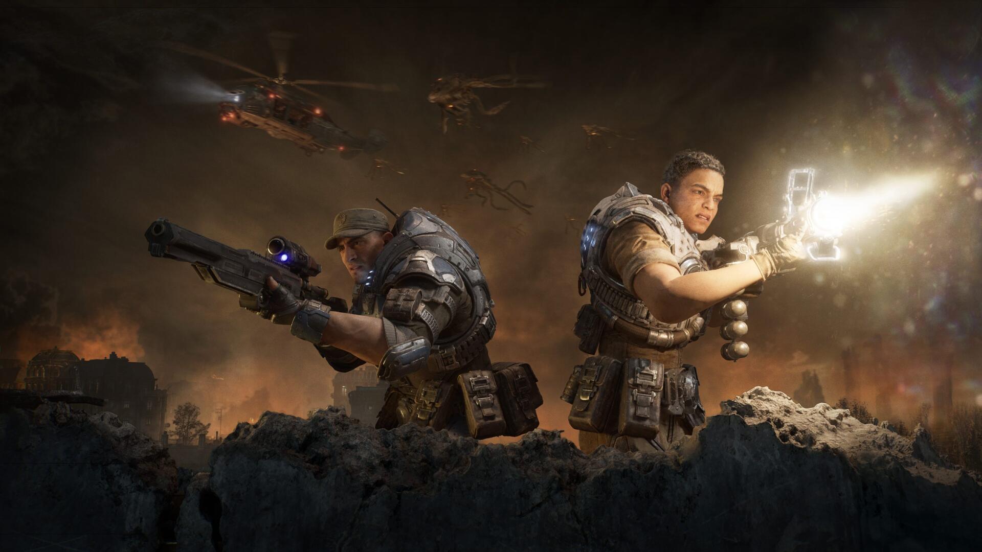 Gears of War: E-Day 2K Quad HD PC desktop wallpaper showing two armored soldiers back-to-back firing weapons on a fiery battlefield as helicopters hover overhead.