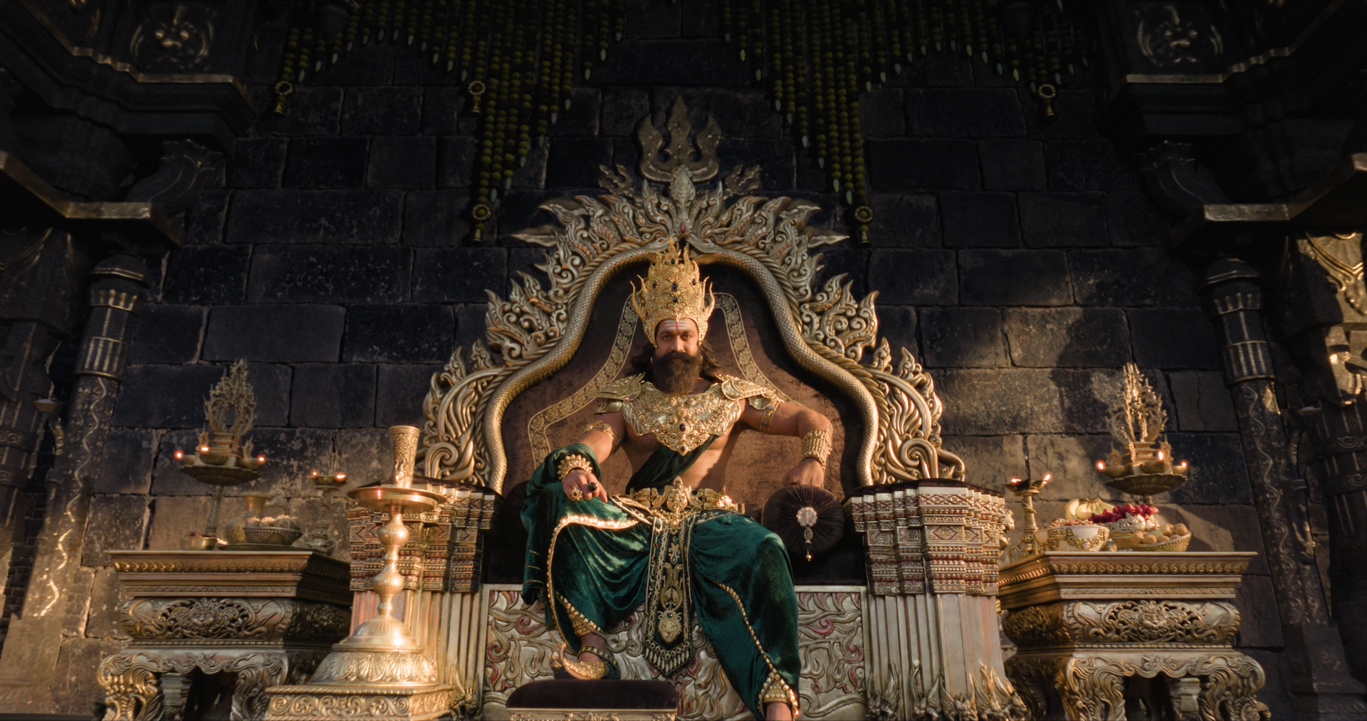 Ramayana (2026) 4K Ultra HD PC desktop wallpaper and background: a regal king seated on an ornate throne amid golden royal decor, bathed in dramatic, cinematic lighting.
