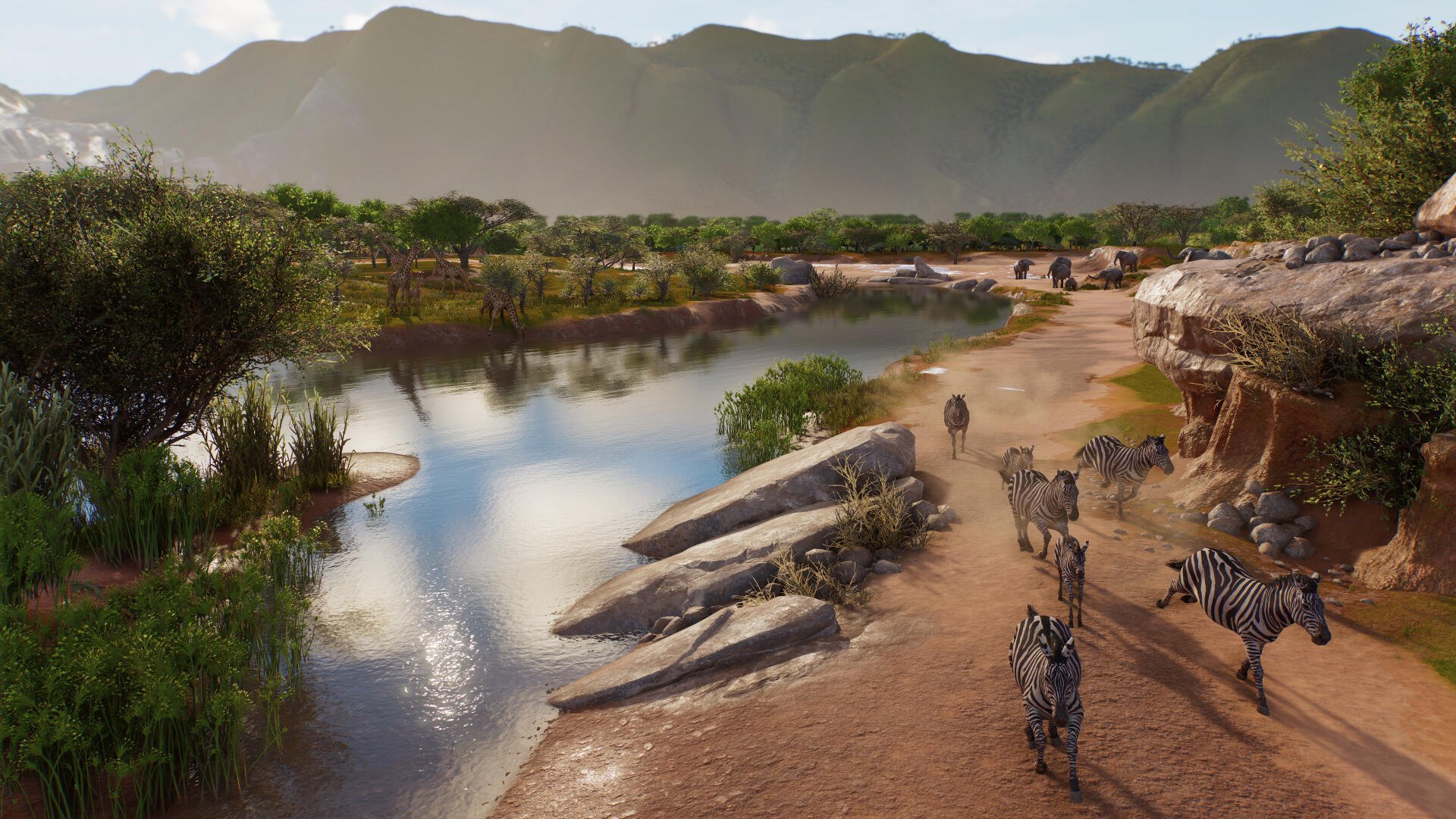 Planet Zoo 2 wildlife wallpaper featuring zebras at a savanna waterhole, with lush greenery and mountains in 4K Ultra HD.