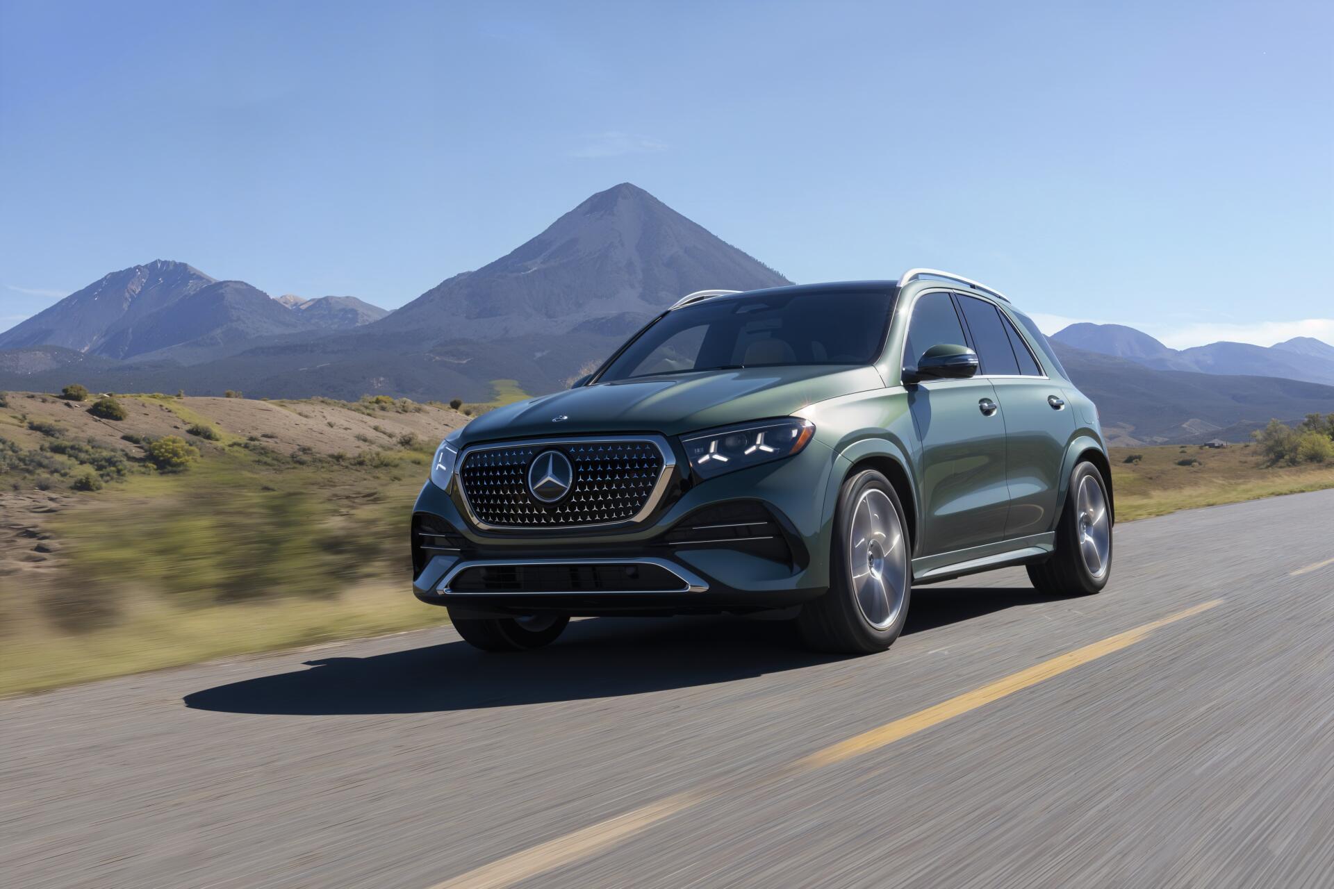 Mercedes-Benz GLS SUV driving along a mountain road in a 4K Ultra HD PC desktop wallpaper background.