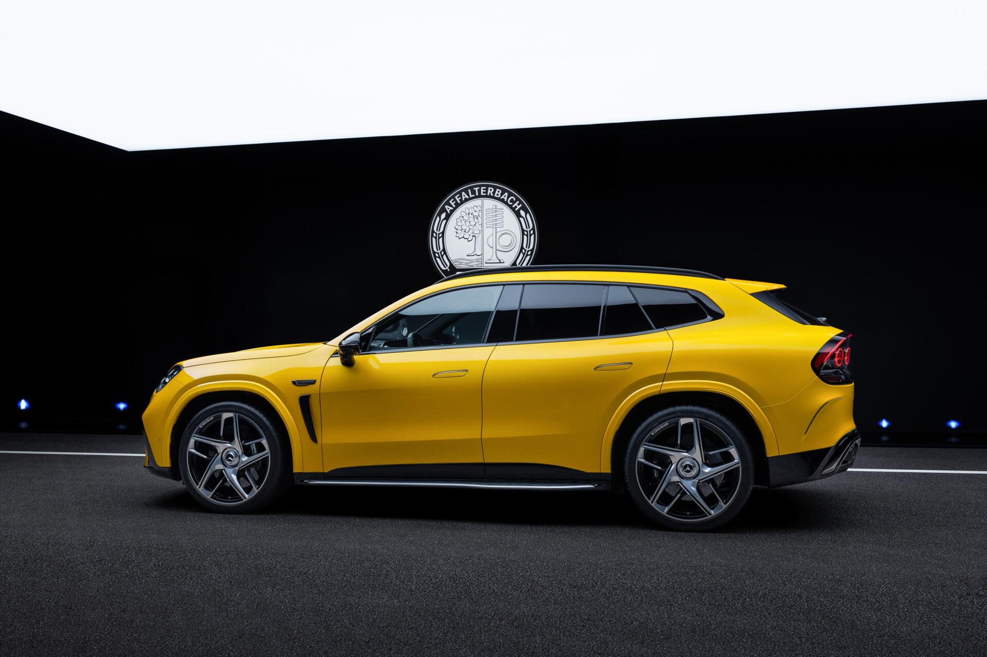 Yellow Mercedes-AMG GT SUV in a dramatic studio setting, 2K Quad HD PC desktop wallpaper background.