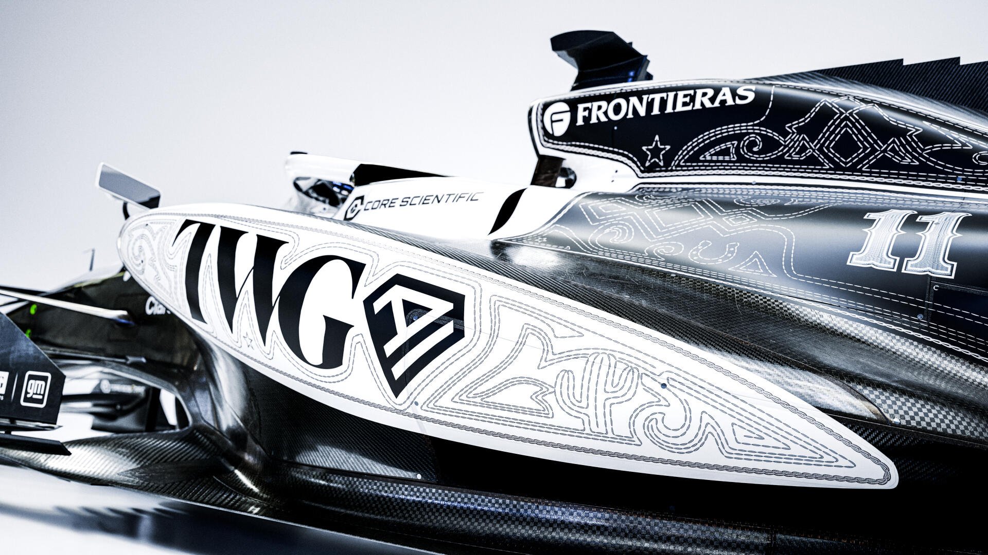 Cadillac MAC-26 powerboat in striking black-and-white Cadillac F1 Team livery, featured in an 8K Ultra HD desktop wallpaper.