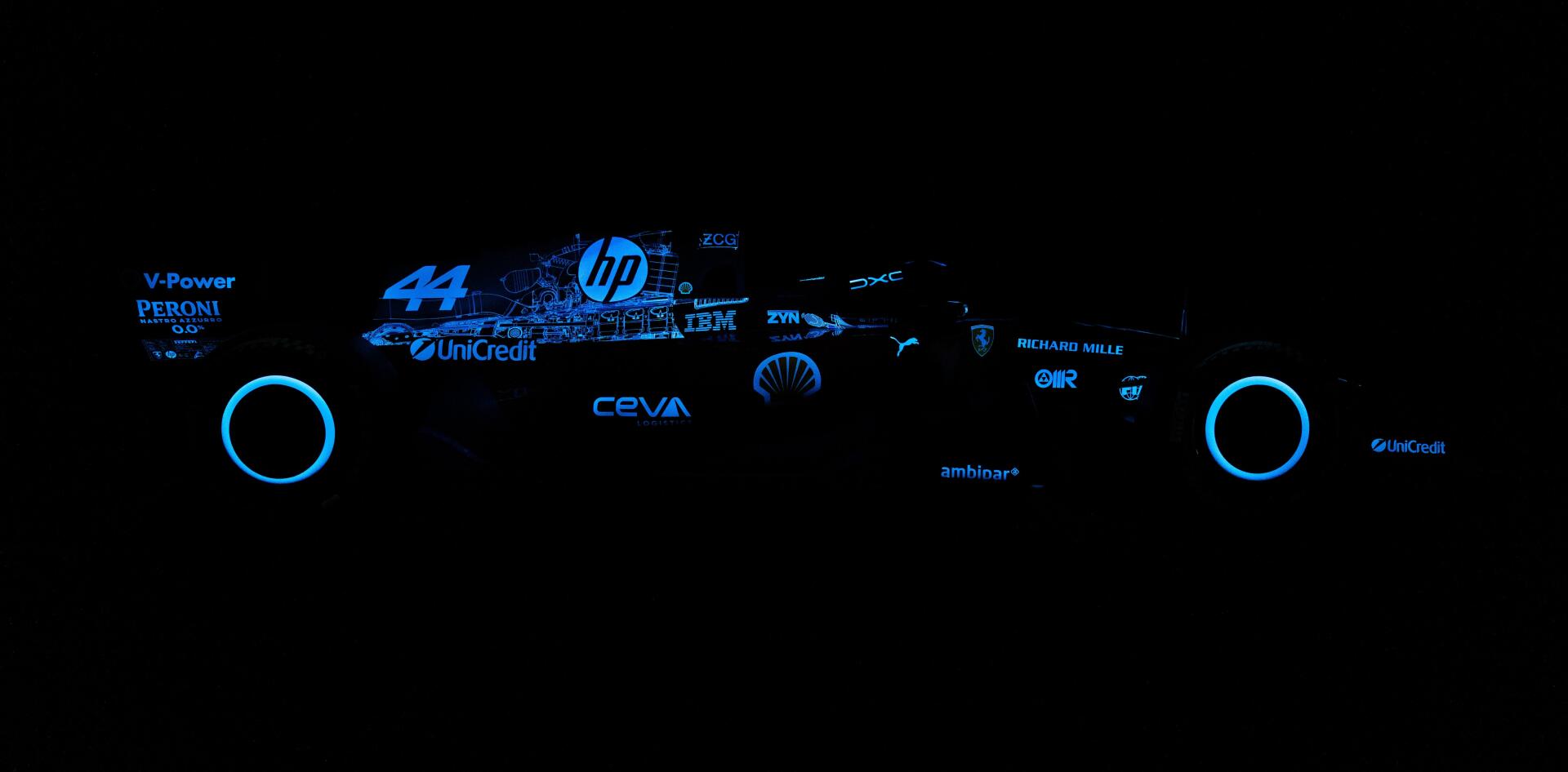 Ferrari SF-26 Formula 1 branding and sponsor logos glow blue against a black 4K Ultra HD PC desktop wallpaper background.