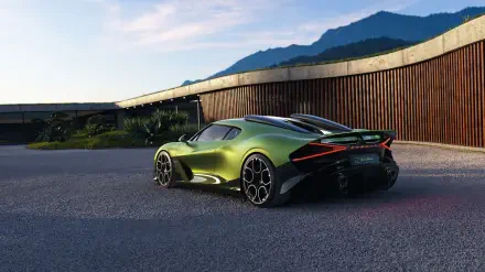 Green Bugatti Brouillard vehicle shown in rear three-quarter view by a modern house and distant mountains — 5K Ultra HD PC desktop wallpaper and background.