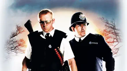 Hot Fuzz 4K Ultra HD PC desktop wallpaper: two stern uniformed police officers—one wearing sunglasses with shotgun-shell bandolier, dramatic sky and silhouetted trees.