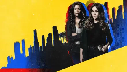 L.A.'S Finest HD PC desktop wallpaper: two female detectives in dark jackets stand before a stylized yellow-and-blue Los Angeles skyline.