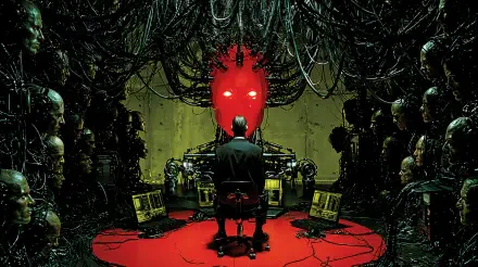2K Quad HD sci‑fi PC wallpaper: a lone figure sits before a glowing red robotic throne of artificial intelligence in a dystopian chamber tangled with cables and towering mechanical figures.