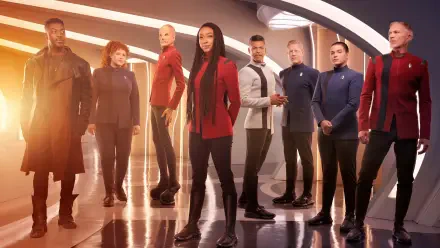 Star Trek: Discovery crew posed on a starship bridge, cinematic 4K Ultra HD PC desktop wallpaper with warm lighting, reflective deck and bold, dramatic composition.