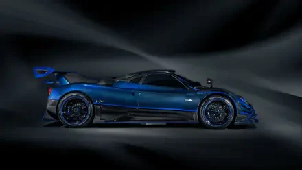 Side profile of a blue Pagani Zonda racing car with aerodynamic wings and carbon accents against a dark, streaked background — 4K Ultra HD PC desktop wallpaper.