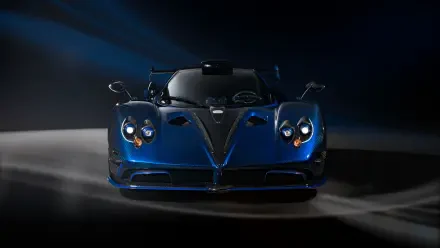 Blue Pagani Zonda racing car, front view on a dark, dramatic backdrop — 4K Ultra HD PC desktop wallpaper/background.