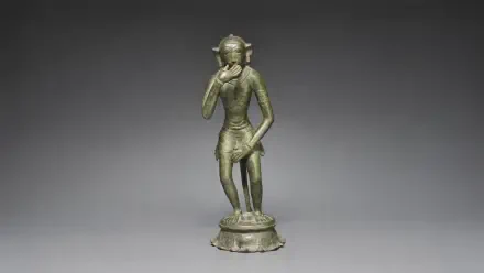 Bronze figurine statue of Lord Hanuman standing with one hand near his face on an ornate base, rendered as a 4K Ultra HD PC desktop wallpaper background.