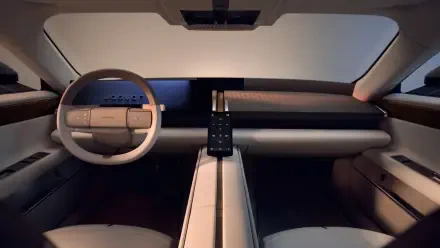 Jaguar Type 01 minimalist car interior with a sculpted dashboard and steering wheel, in 4K Ultra HD desktop wallpaper.