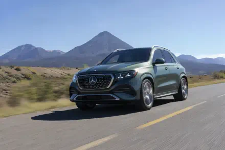 Mercedes-Benz GLS SUV driving along a mountain road in a 4K Ultra HD PC desktop wallpaper background.